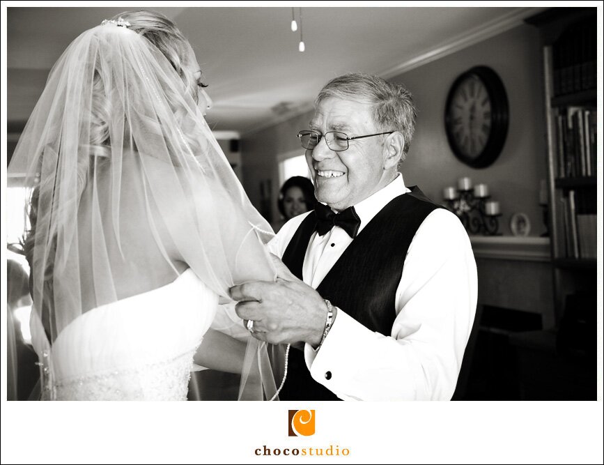 Bride with her father getting ready for ceremony