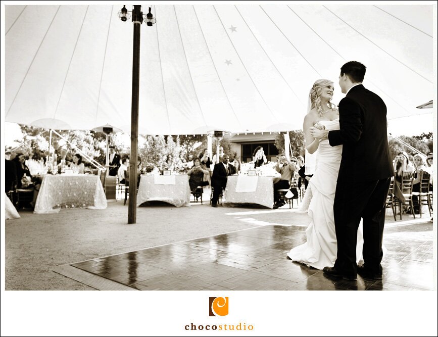 Bride and groom dancing under the tent