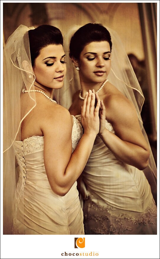 Bride posing next to a mirror during a Persian Wedding