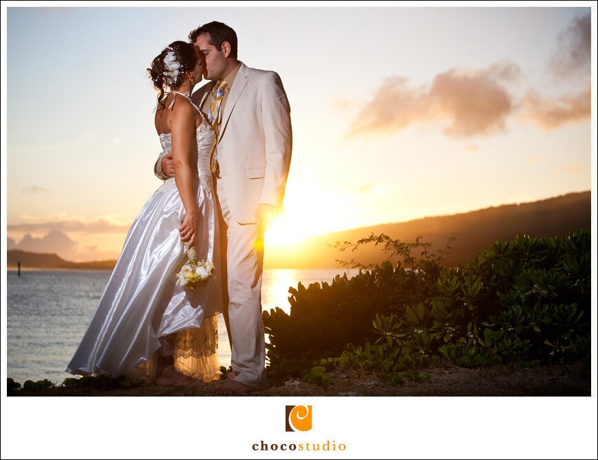 Sunset wedding photo of bride and groom in Hawaii