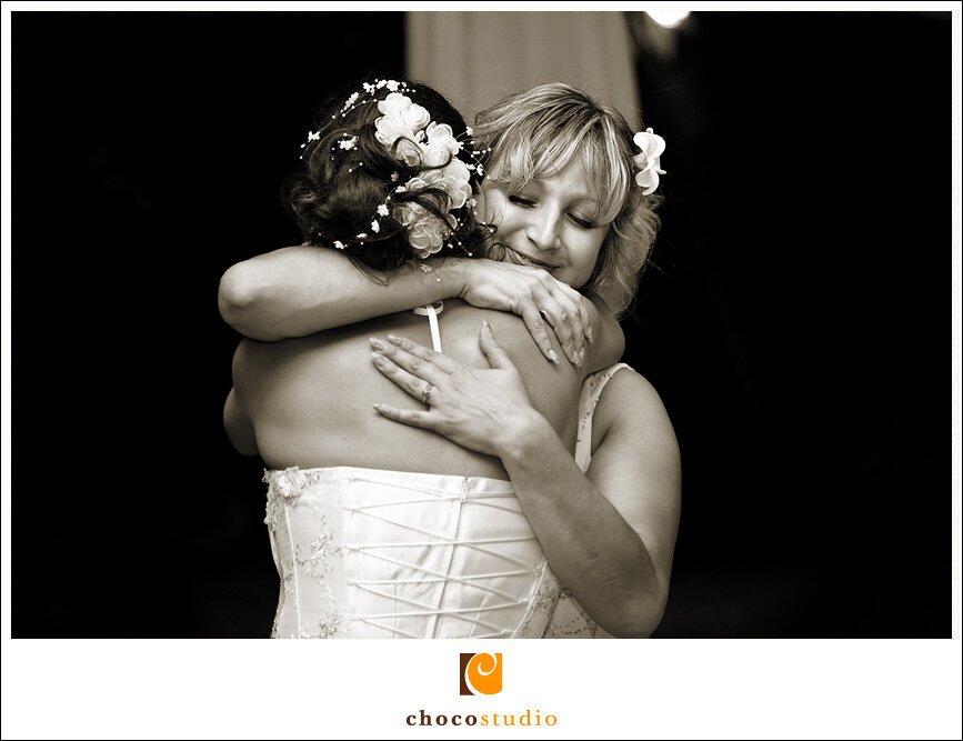 Maid of Honor and Bride Hugging