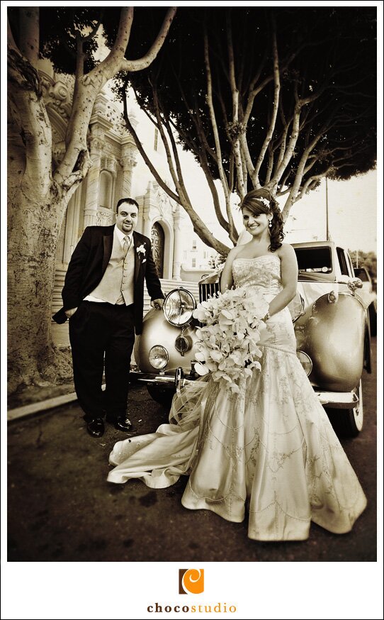 Bride and groom photo next to a Rolls Royce