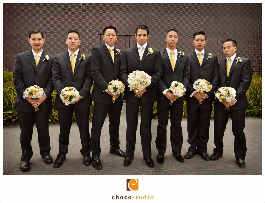 Groomsmen with bouquets at De Young Museum in San Francisco